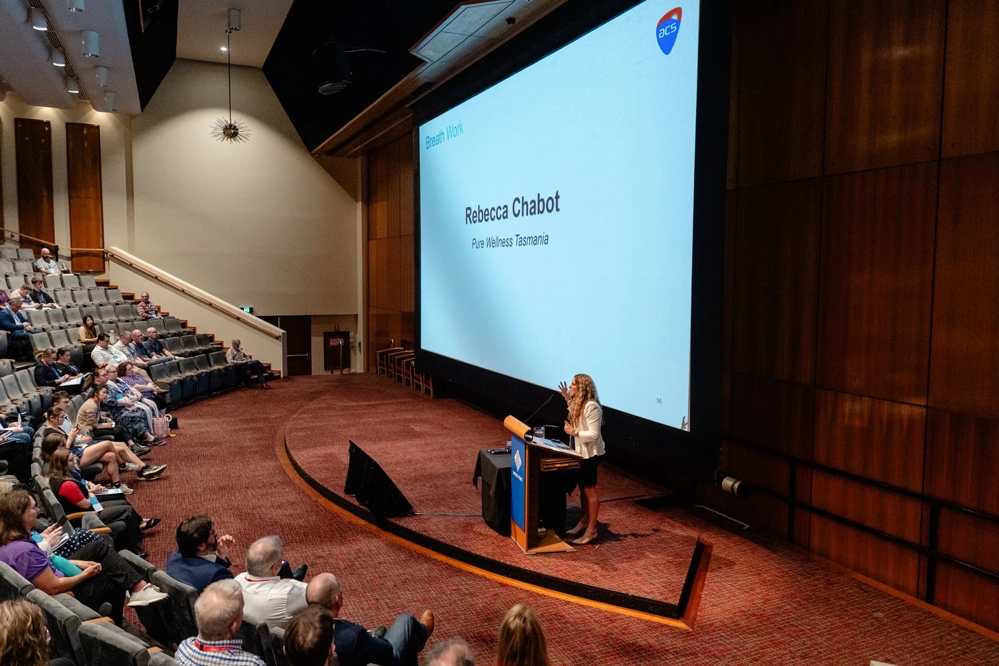 Dr Rebecca Chabot speaking on stage